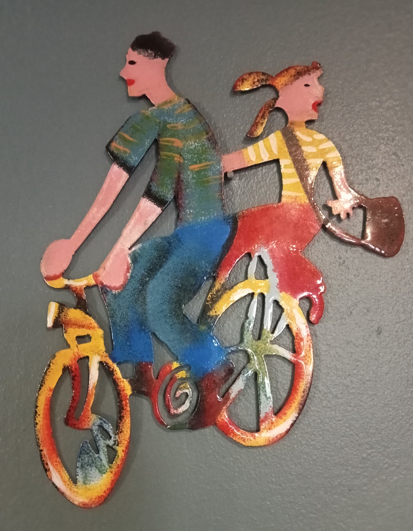 Metal bicycle riders wall hanging