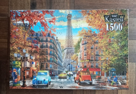 Jigsaw puzzle box featuring a scenic view of Paris with the Eiffel Tower.