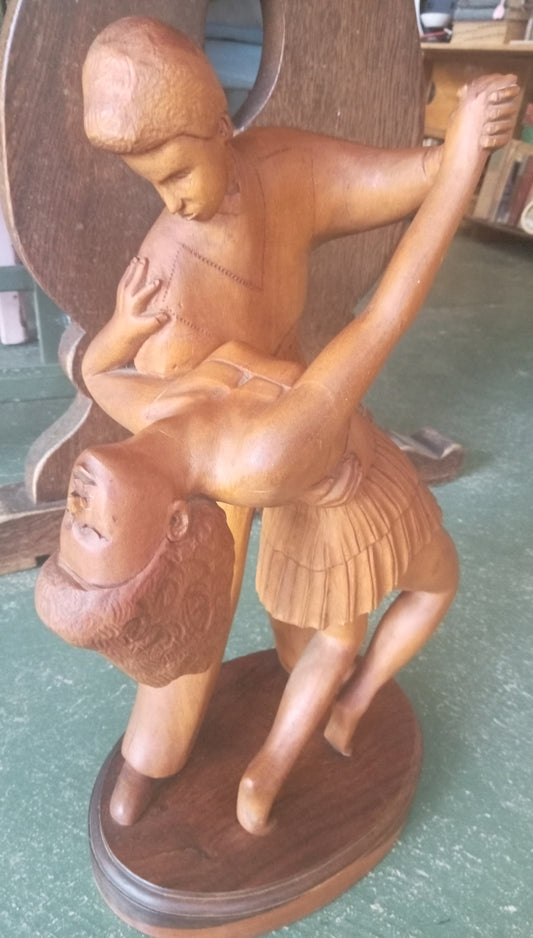 Wooden carving dancing pair